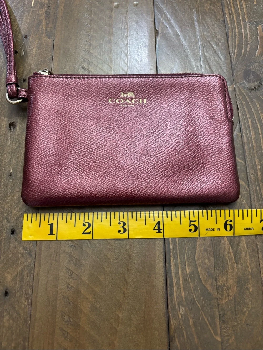 Coach Pebbled Leather Wristlet in Metallic Burgundy